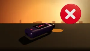 Disposable vape left on a car dashboard in the summer sun, which can cause leaks